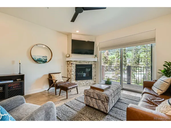 a living room with furniture fireplace and a flat screen tv