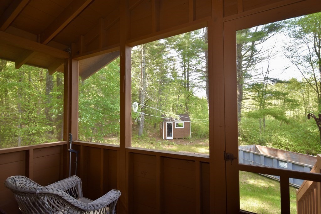 572 Snipatuit Road Rochester, MA 02770 - Photo 6 of 6 a view of a porch with furniture and backyard