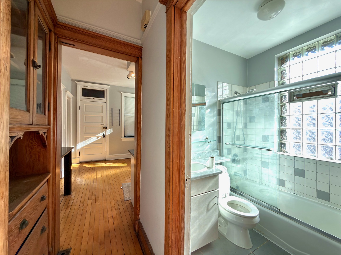 Undisclosed Address Chicago, IL 60647 - Photo 11 of 20 a bathroom with a granite countertop sink mirror vanity and toilet