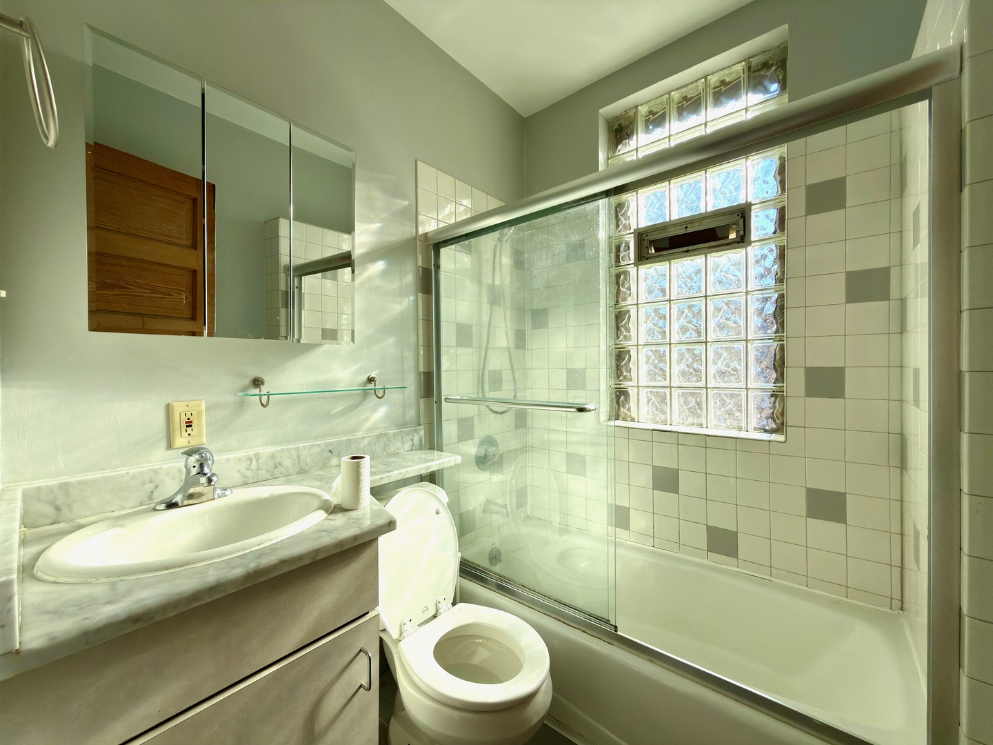 Undisclosed Address Chicago, IL 60647 - Photo 12 of 20 a bathroom with a sink toilet and shower