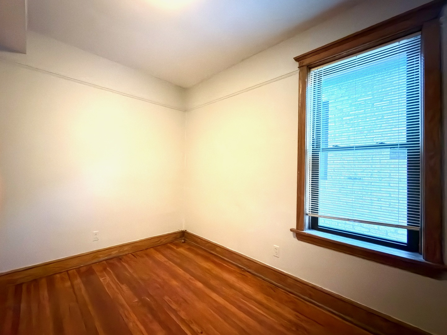 Undisclosed Address Chicago, IL 60647 - Photo 16 of 20 a view of a small space with wooden floor and a window