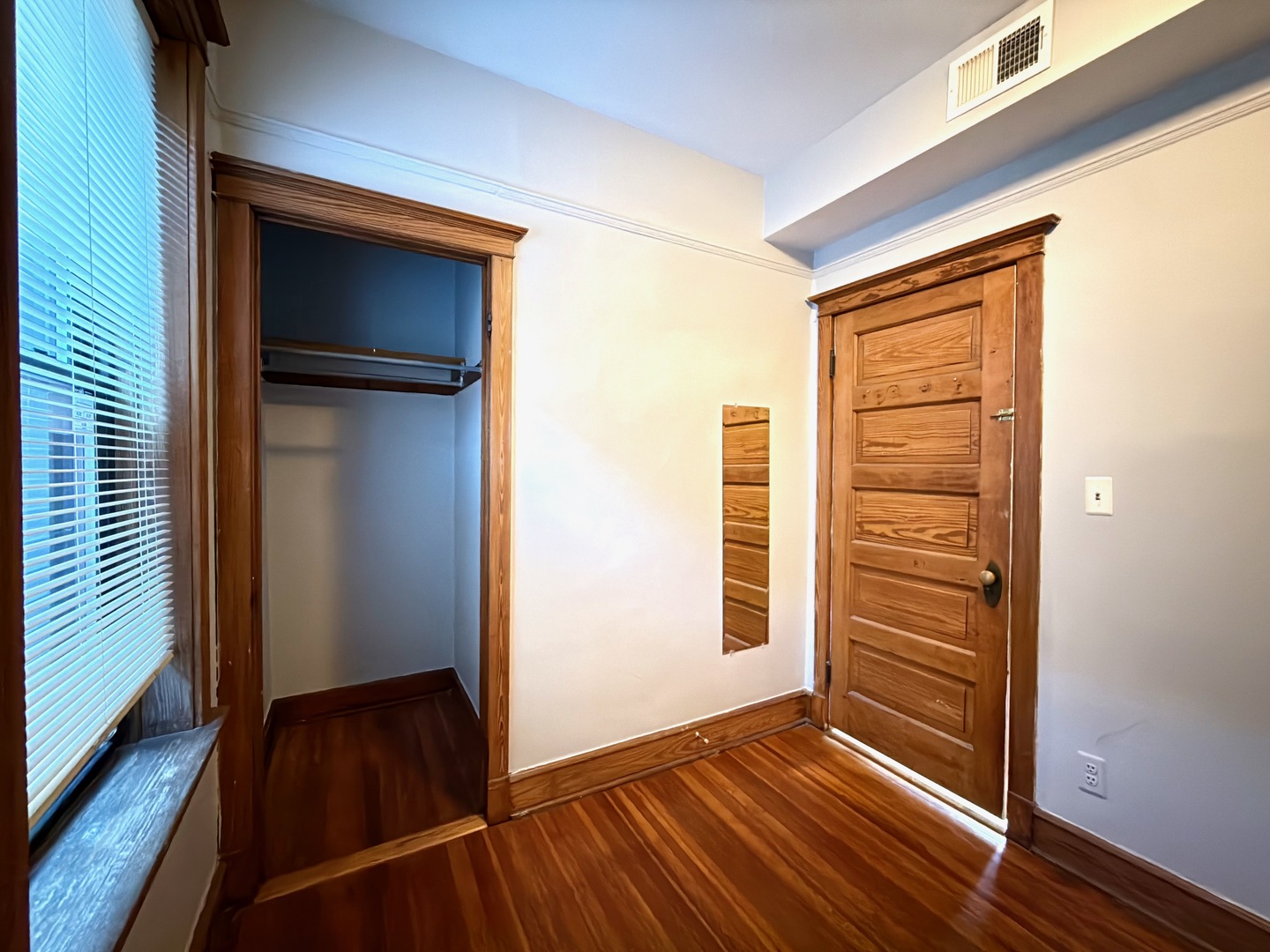 Undisclosed Address Chicago, IL 60647 - Photo 17 of 20 a view of a hallway with wooden floor and closet