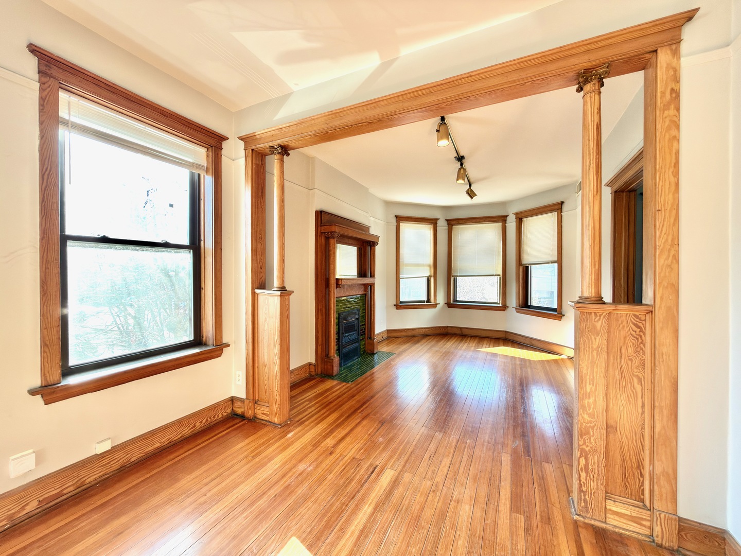 Undisclosed Address Chicago, IL 60647 - Photo 5 of 20 a view of an empty room with wooden floor and a window