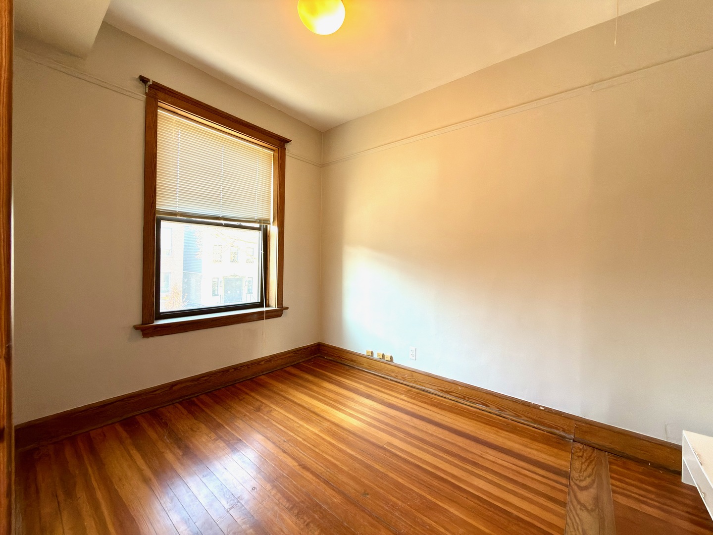 Undisclosed Address Chicago, IL 60647 - Photo 7 of 20 an empty room with wooden floor and windows