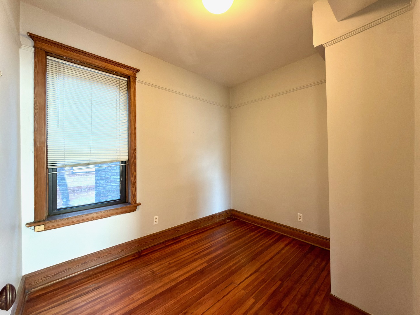 Undisclosed Address Chicago, IL 60647 - Photo 9 of 20 a view of a small space with wooden floor and a window