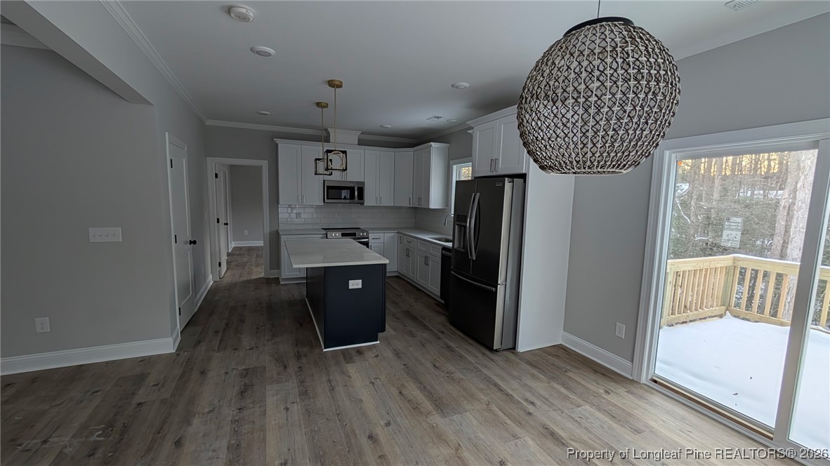 5130 Cardinal Circle Sanford, NC 27332 - Photo 14 of 36 a kitchen with stainless steel appliances a refrigerator and a sink