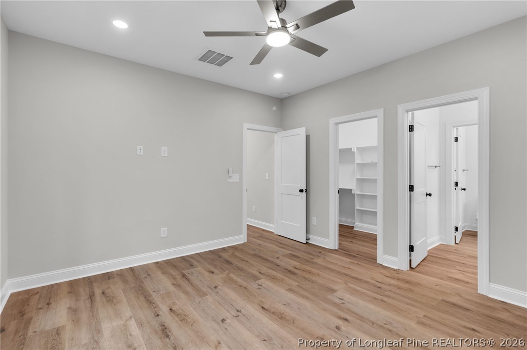 5130 Cardinal Circle Sanford, NC 27332 - Photo 16 of 45 a view of an empty room with wooden floor