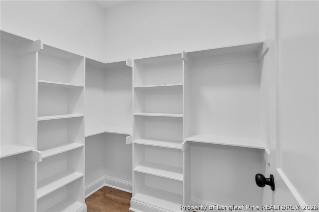 5130 Cardinal Circle Sanford, NC 27332 - Photo 17 of 45 a view of walk in closet with empty racks
