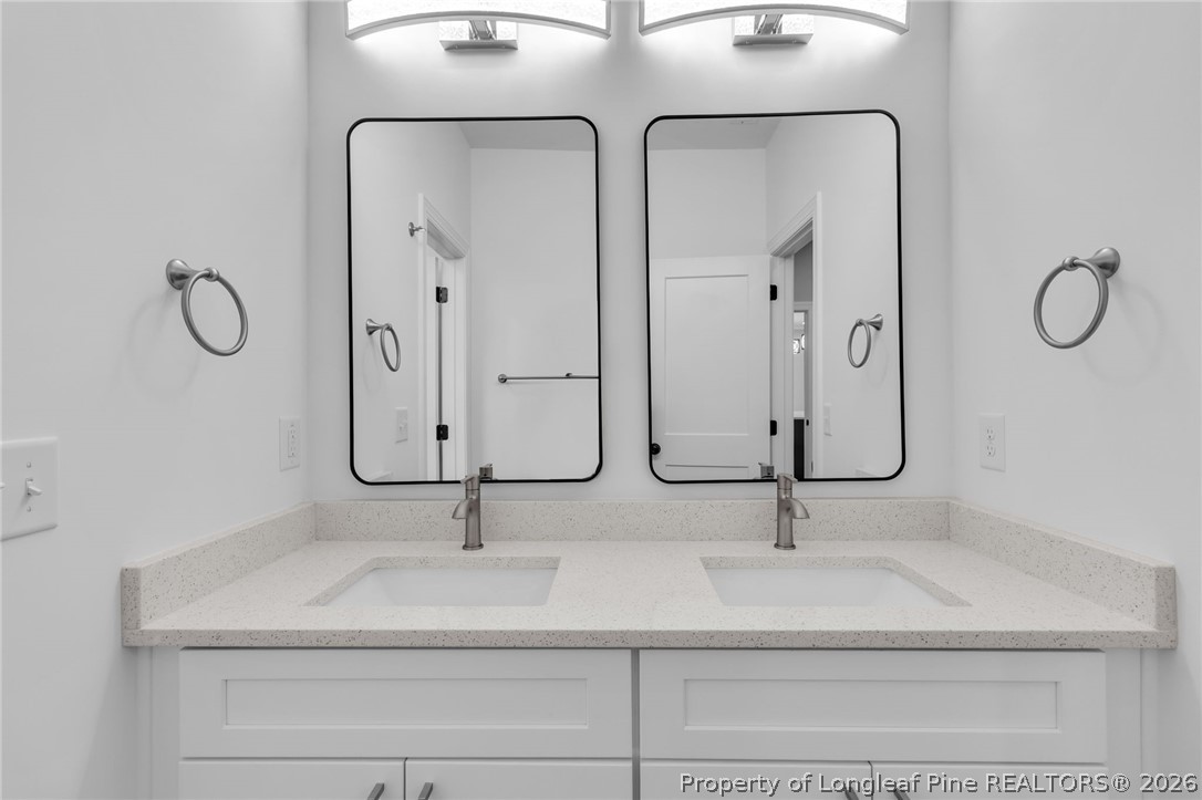 5130 Cardinal Circle Sanford, NC 27332 - Photo 20 of 45 a bathroom with a sink and mirror
