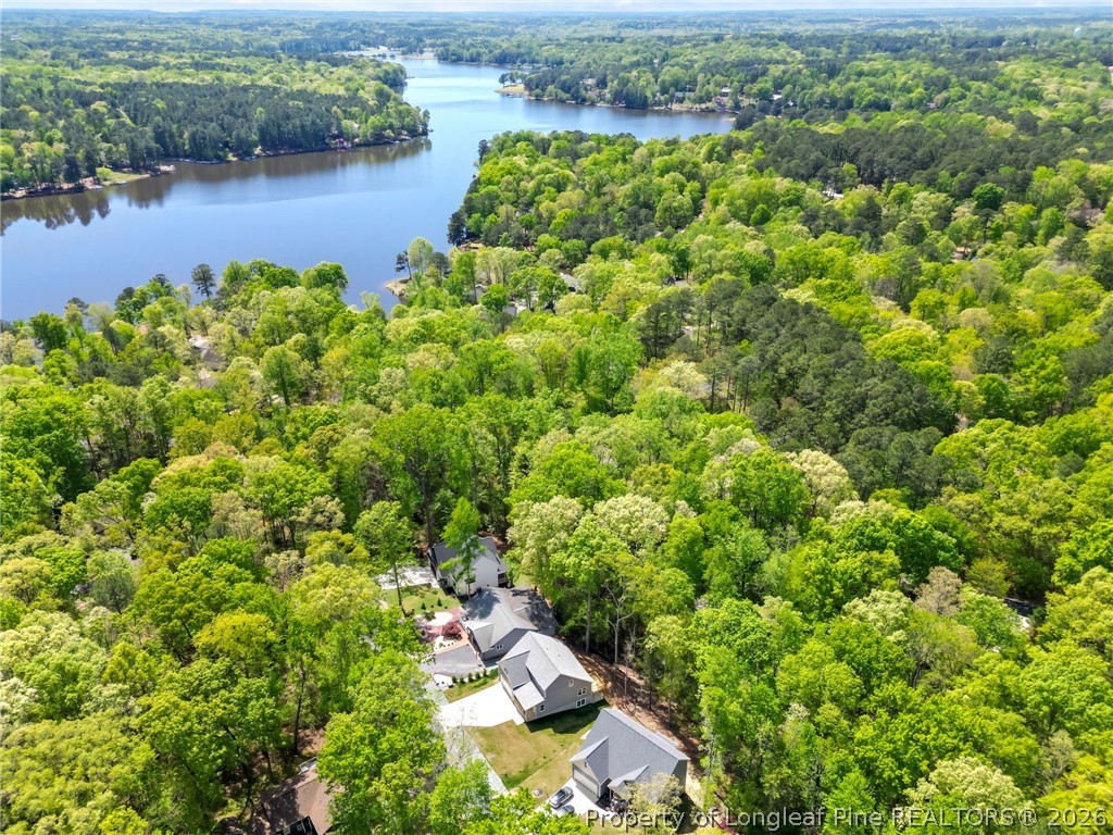 5130 Cardinal Circle Sanford, NC 27332 - Photo 2 of 45 an aerial view of a house with a yard and lake view