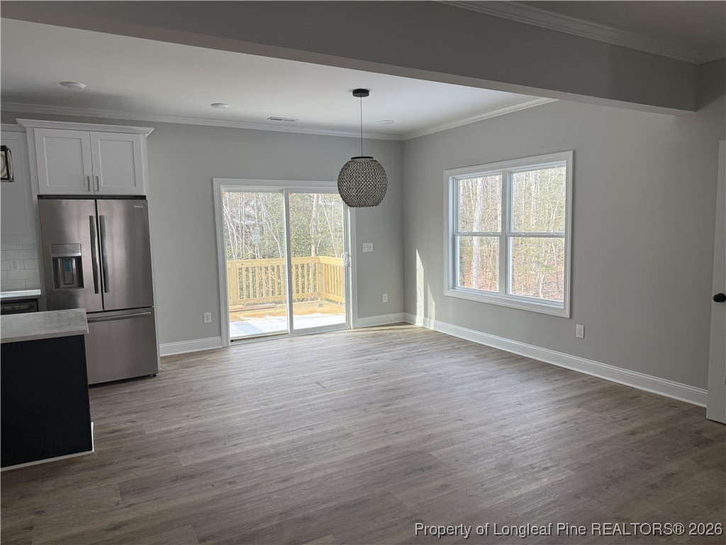5130 Cardinal Circle Sanford, NC 27332 - Photo 21 of 36 a view of an empty room with window and wooden floor