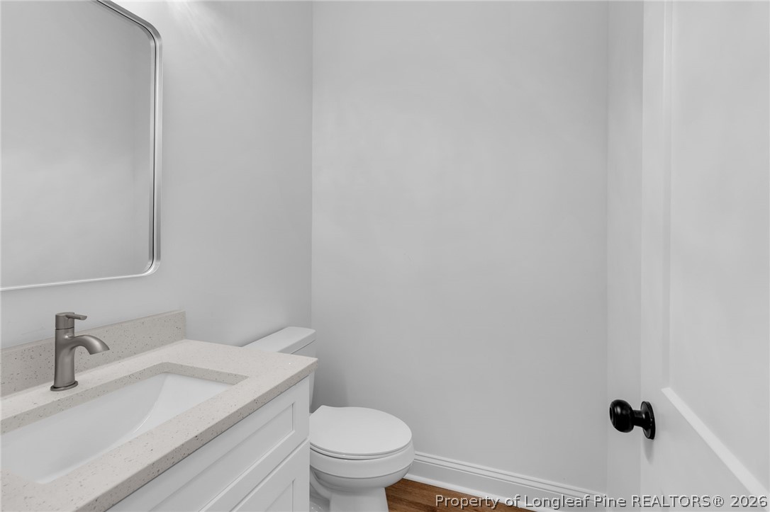 5130 Cardinal Circle Sanford, NC 27332 - Photo 21 of 45 a bathroom with a sink and a toilet
