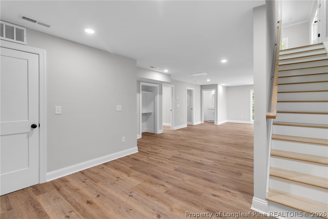 5130 Cardinal Circle Sanford, NC 27332 - Photo 23 of 45 a view of a hallway with wooden floor