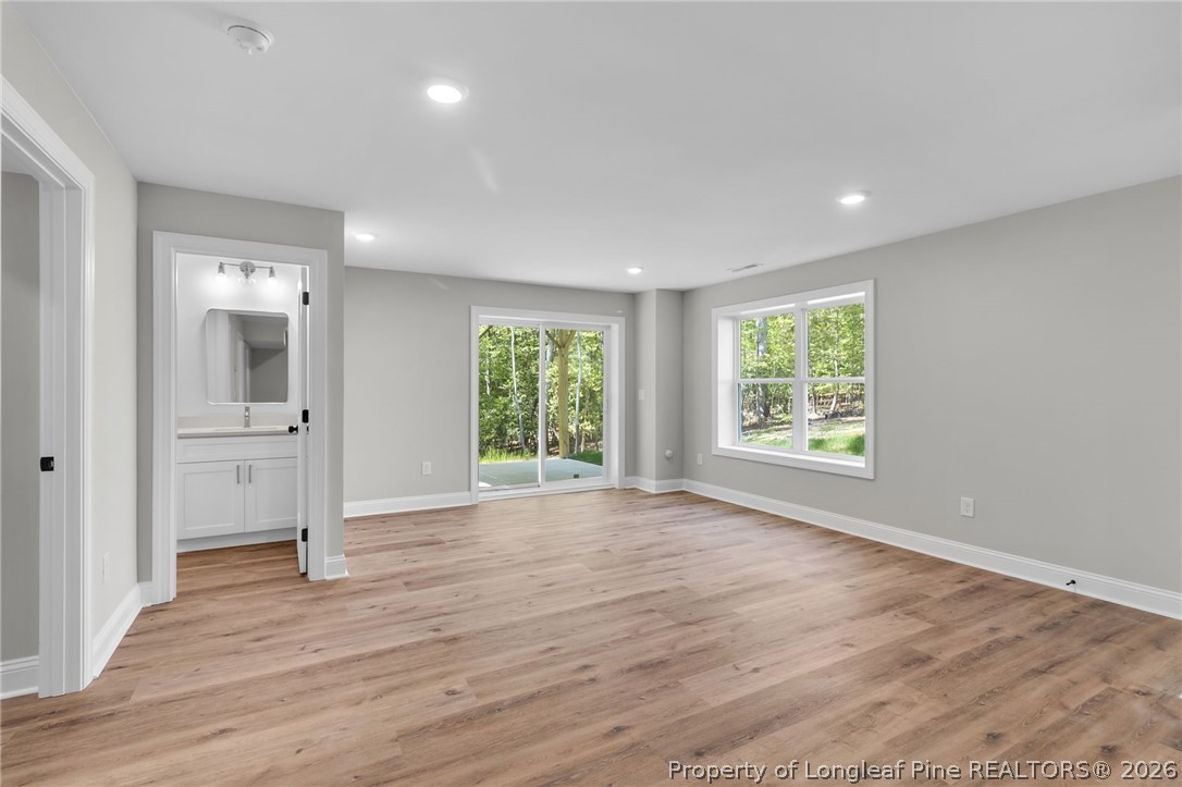 5130 Cardinal Circle Sanford, NC 27332 - Photo 24 of 45 wooden floor in an empty room with a window