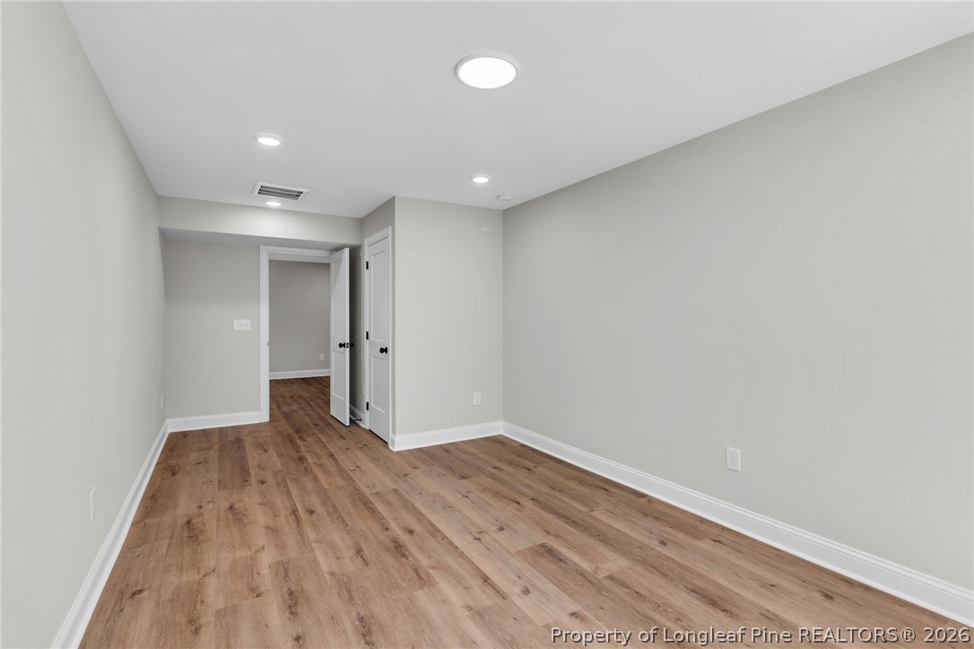 5130 Cardinal Circle Sanford, NC 27332 - Photo 31 of 45 a view of wooden floor and windows in a room