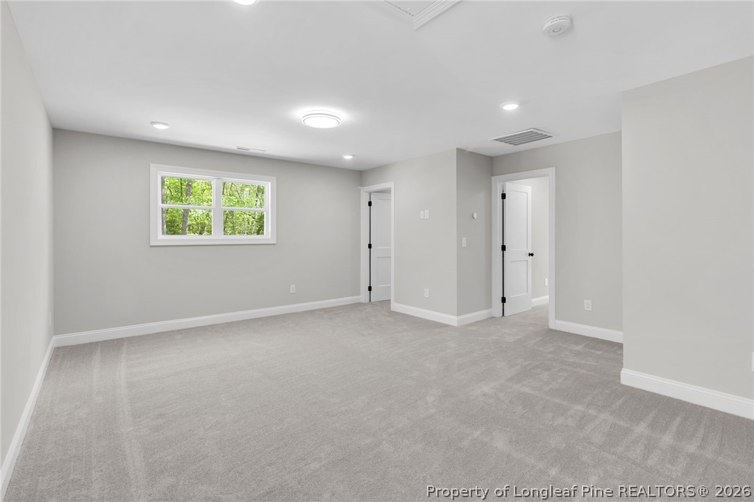 5130 Cardinal Circle Sanford, NC 27332 - Photo 32 of 45 an empty room with windows