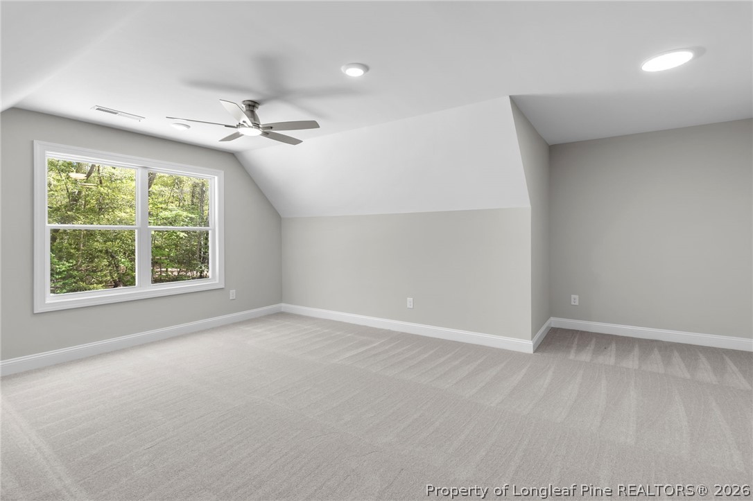 5130 Cardinal Circle Sanford, NC 27332 - Photo 34 of 45 an empty room with windows and ceiling fan