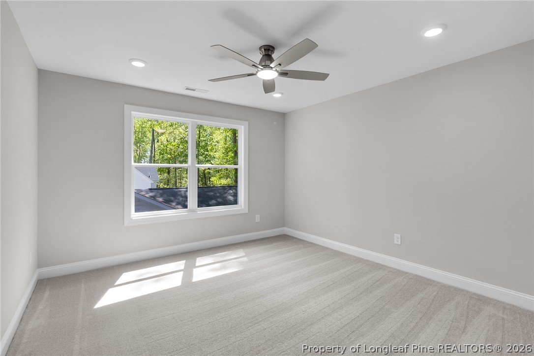 5130 Cardinal Circle Sanford, NC 27332 - Photo 37 of 45 wooden floor in an empty room with a window