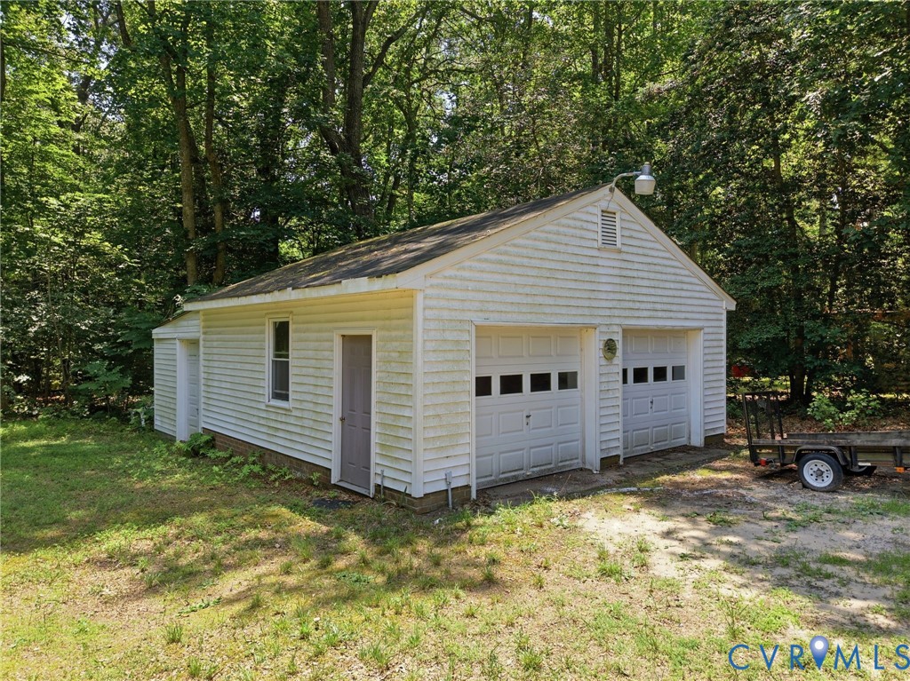 10111 Tunstall Road New Kent, VA 23124 - Photo 4 of 52 Detached two-car garage featuring white horizontal
