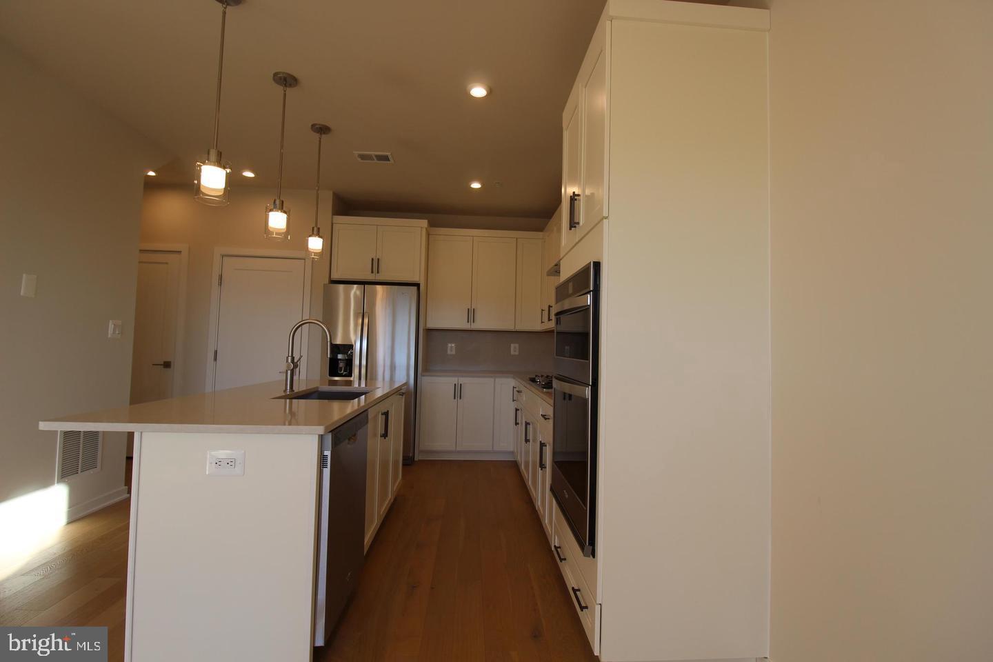 22383 Roanoke Rise Terrace Ashburn, VA 20148 - Photo 10 of 41 a kitchen with a sink stainless steel appliances and cabinets