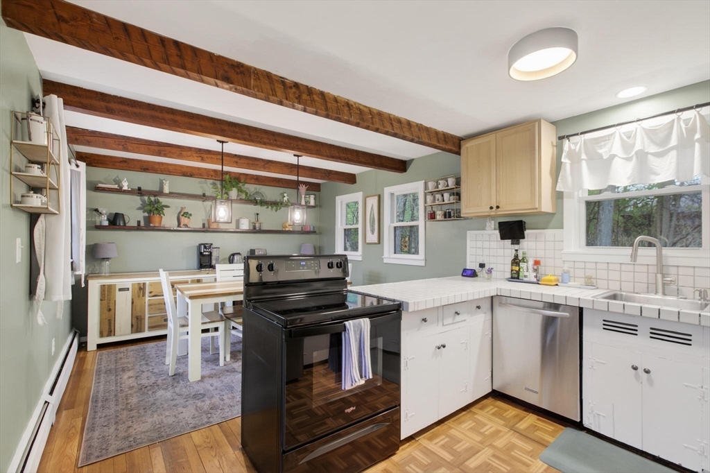 14 Francis Wyman Road Burlington, MA 01803 - Photo 16 of 41 a kitchen with a stove top oven sink and cabinets