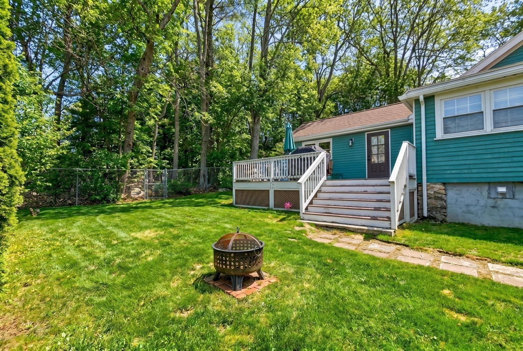 14 Francis Wyman Road Burlington, MA 01803 - Photo 31 of 41 a view of a backyard with wooden fence and a bench