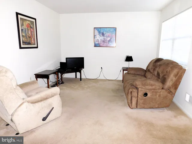 a living room with furniture and a couch