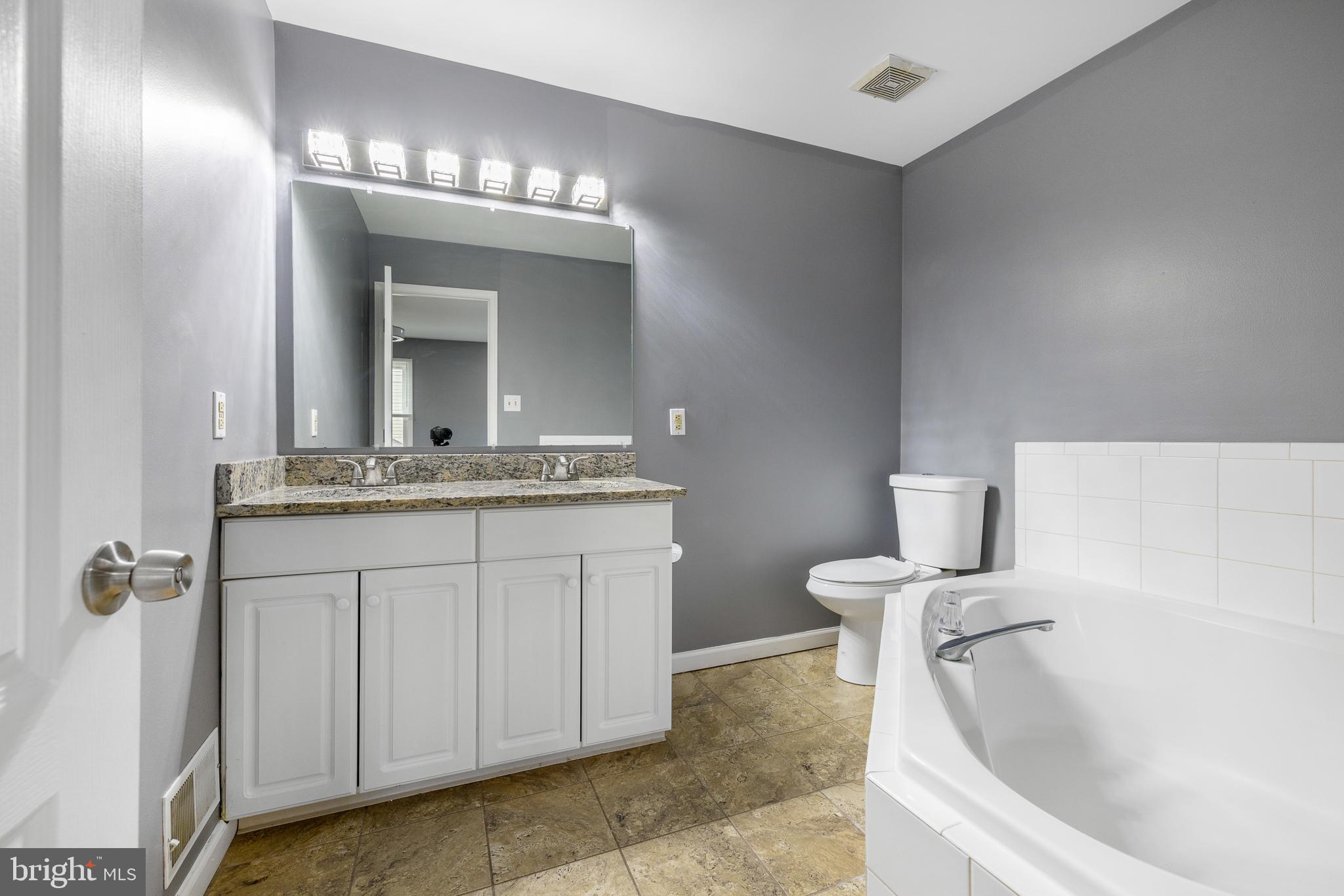 93 Nursery Drive Bear, DE 19701 - Photo 18 of 43 a bathroom with a sink and a mirror
