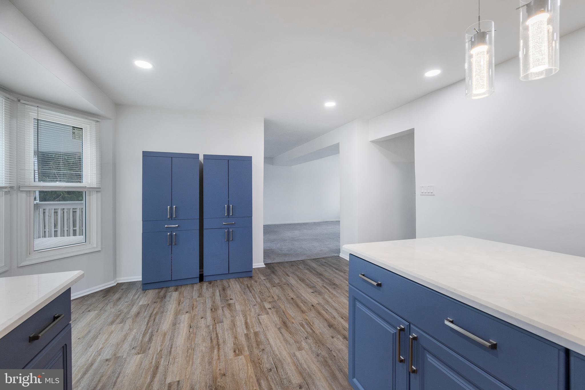 93 Nursery Drive Bear, DE 19701 - Photo 26 of 43 a view of hallway with wooden floor and cabinet