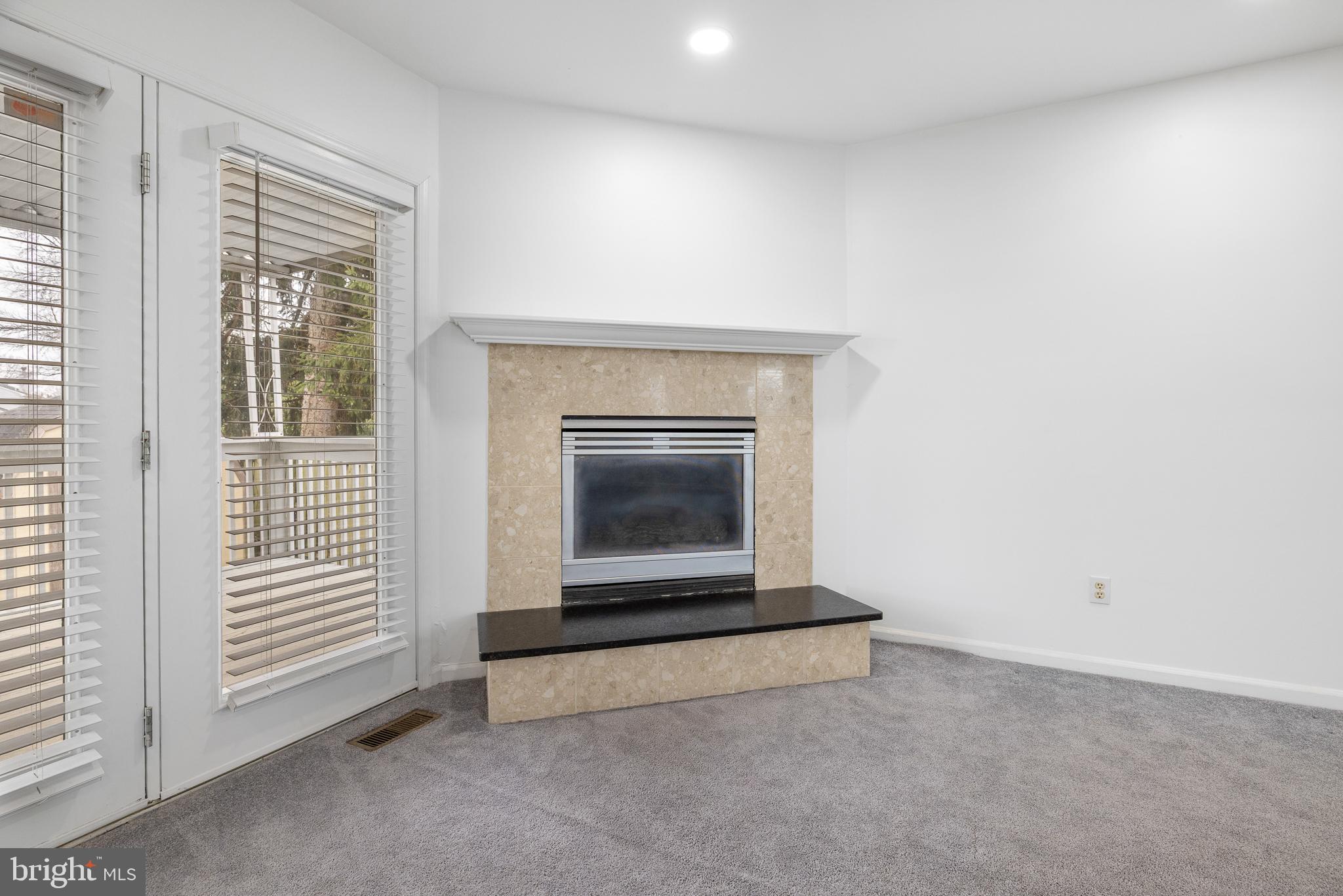 93 Nursery Drive Bear, DE 19701 - Photo 28 of 43 an empty room with a fireplace
