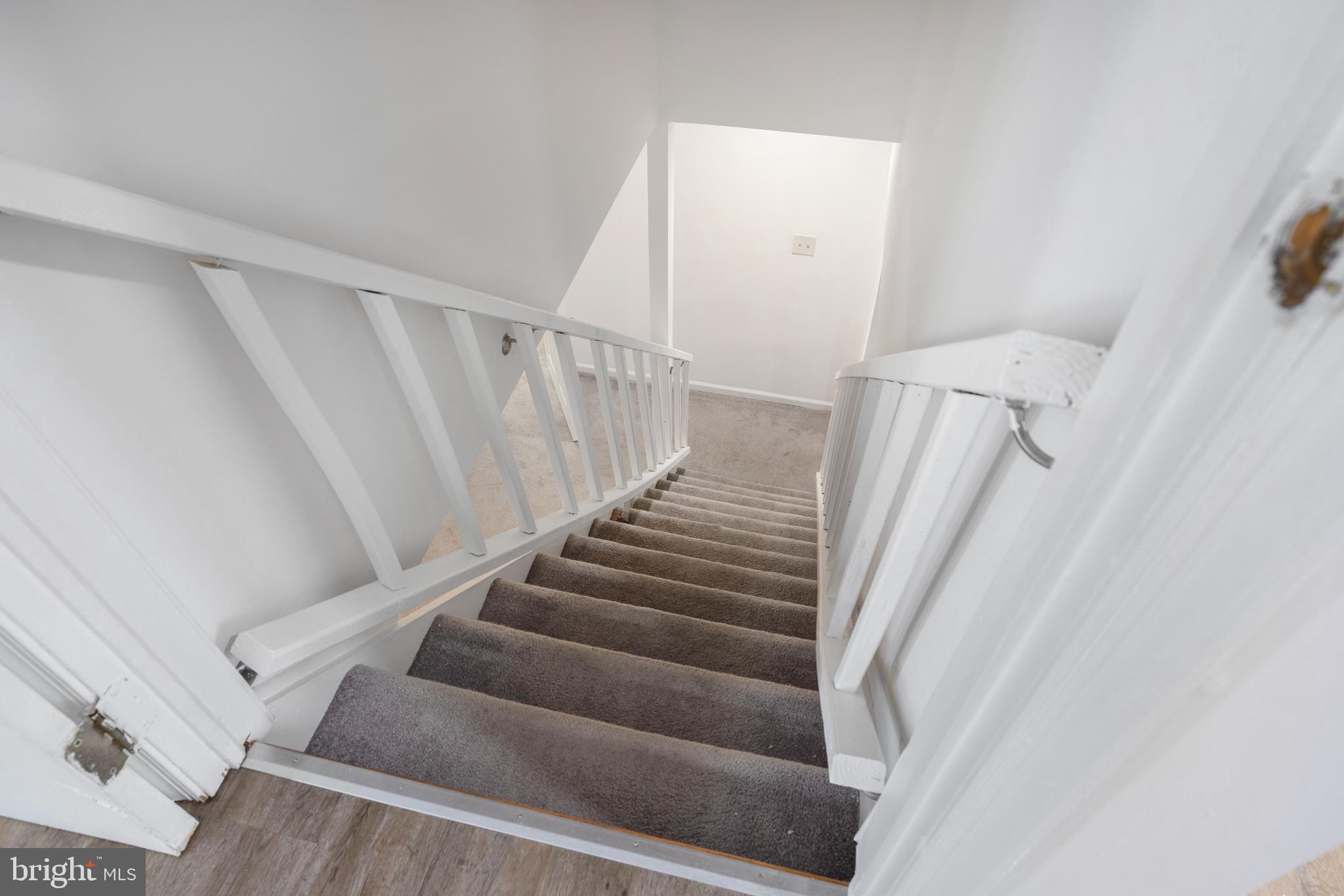 93 Nursery Drive Bear, DE 19701 - Photo 31 of 43 a view of staircase with white walls and white door