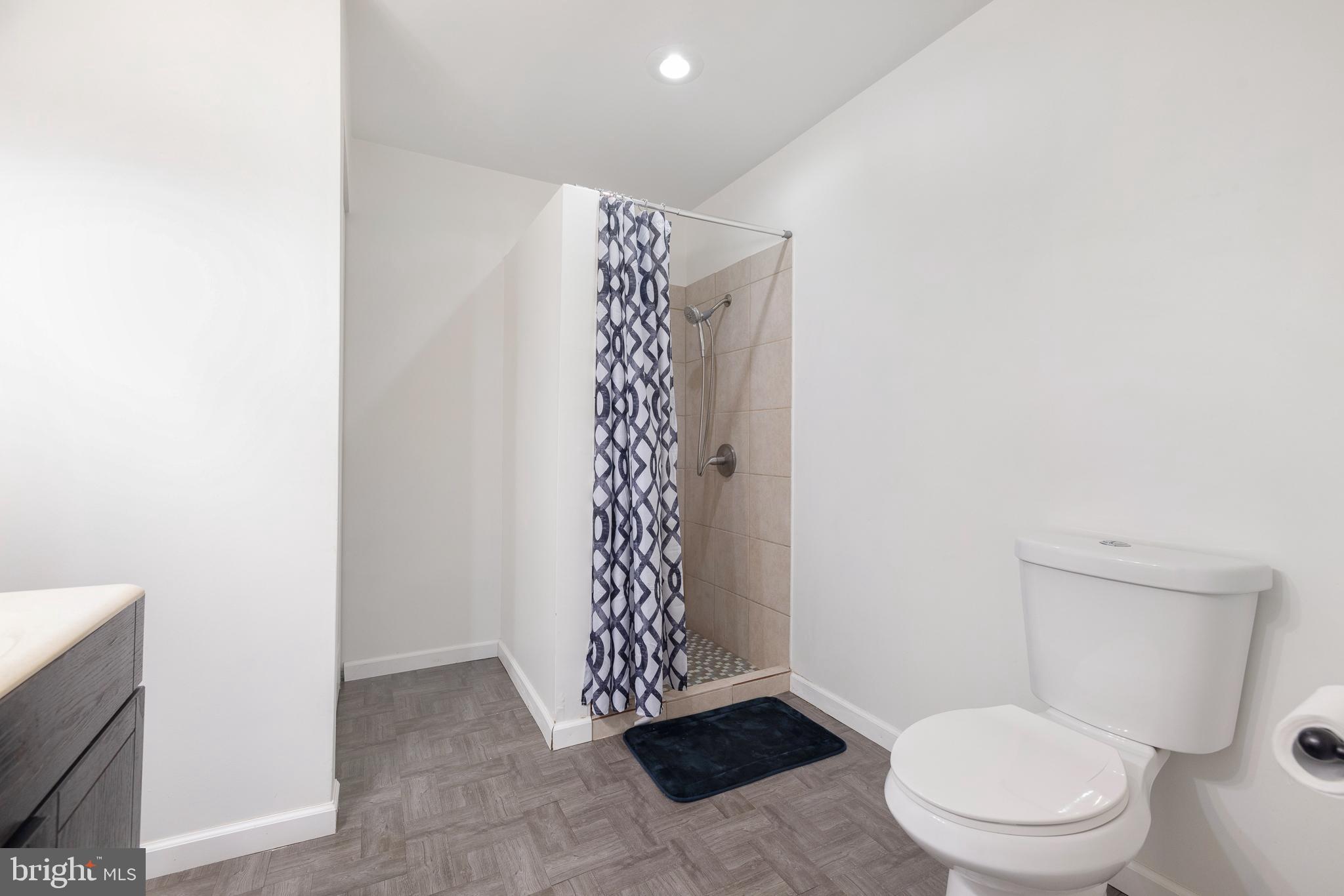 93 Nursery Drive Bear, DE 19701 - Photo 37 of 43 a bathroom with a toilet and a shower
