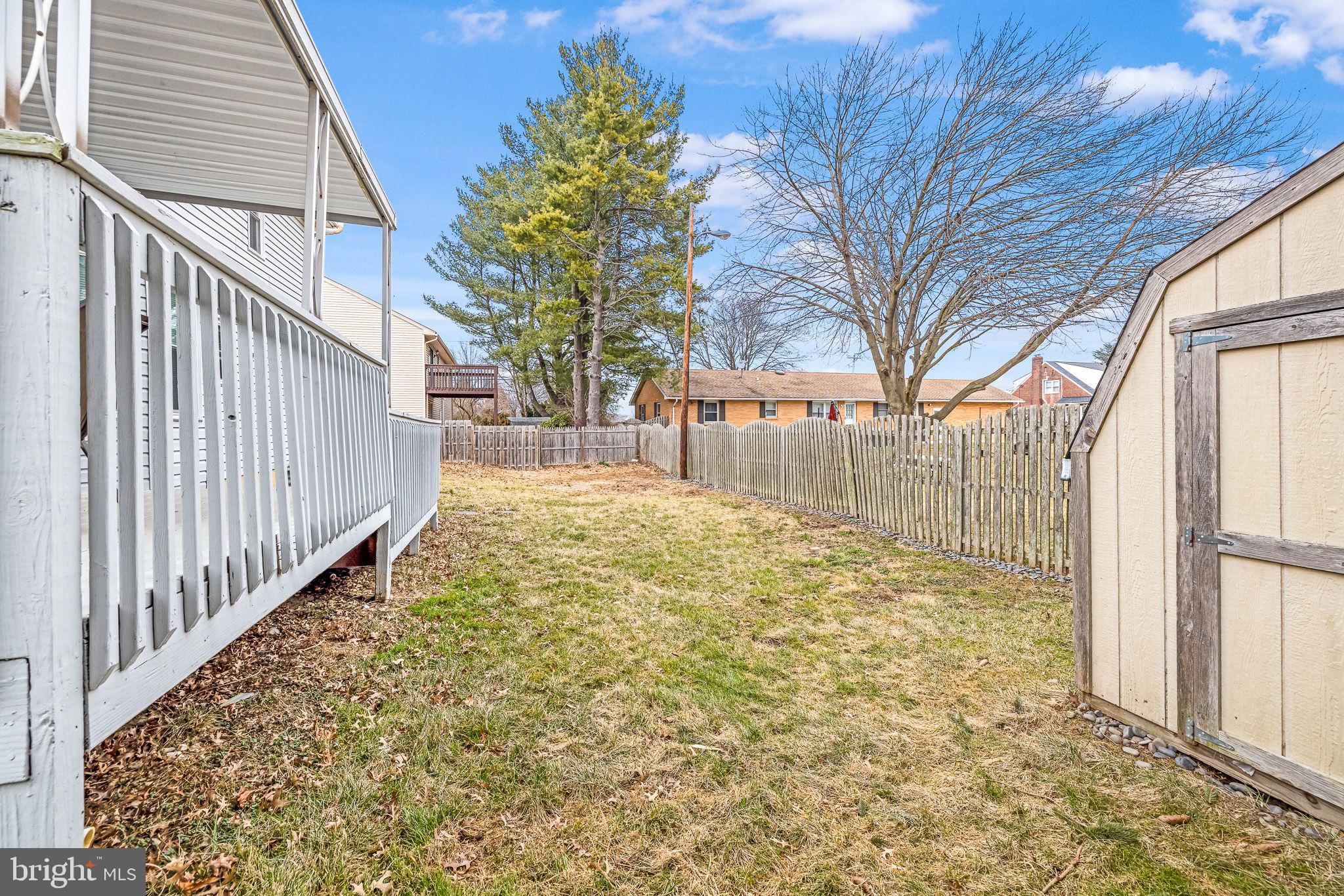 93 Nursery Drive Bear, DE 19701 - Photo 42 of 43 a view of a yard with wooden fence and large trees
