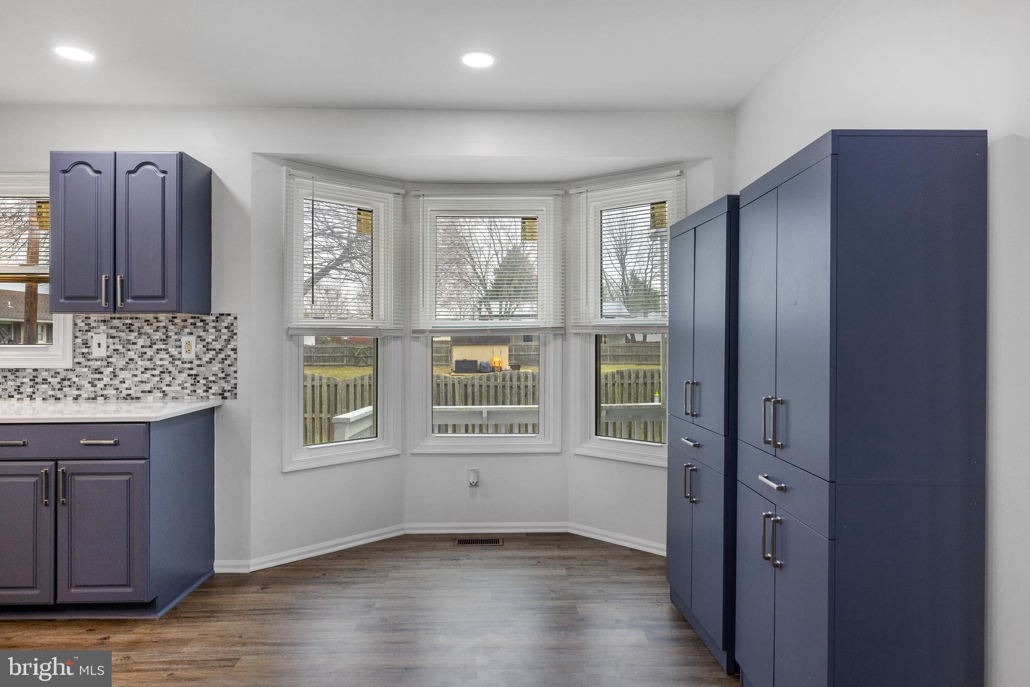 93 Nursery Drive Bear, DE 19701 - Photo 7 of 43 a view of an empty room with wooden floor and a window