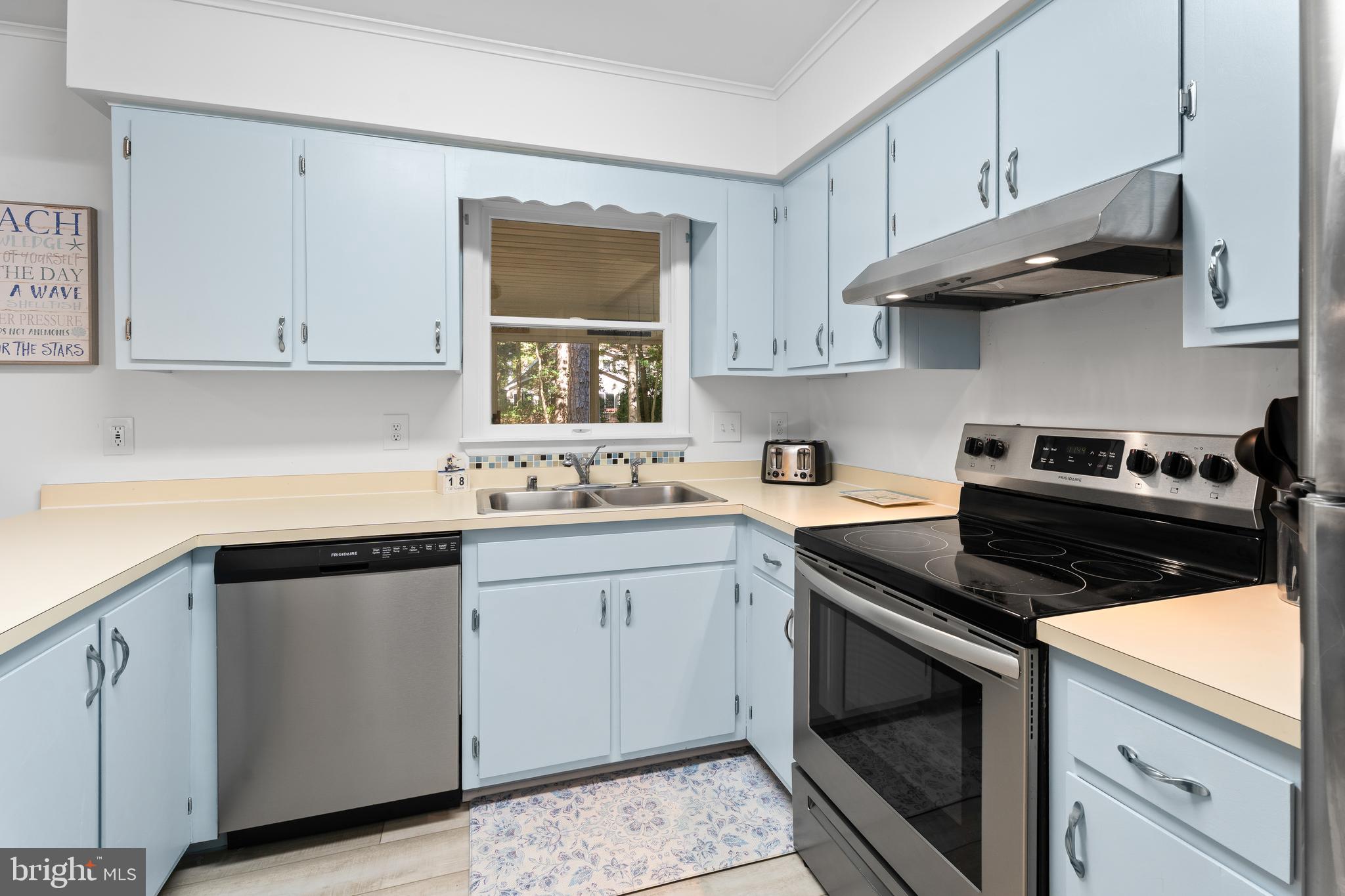85 Ocean Parkway Ocean Pines, MD 21811 - Photo 19 of 78 a kitchen with stainless steel appliances granite countertop white cabinets and a stove a sink
