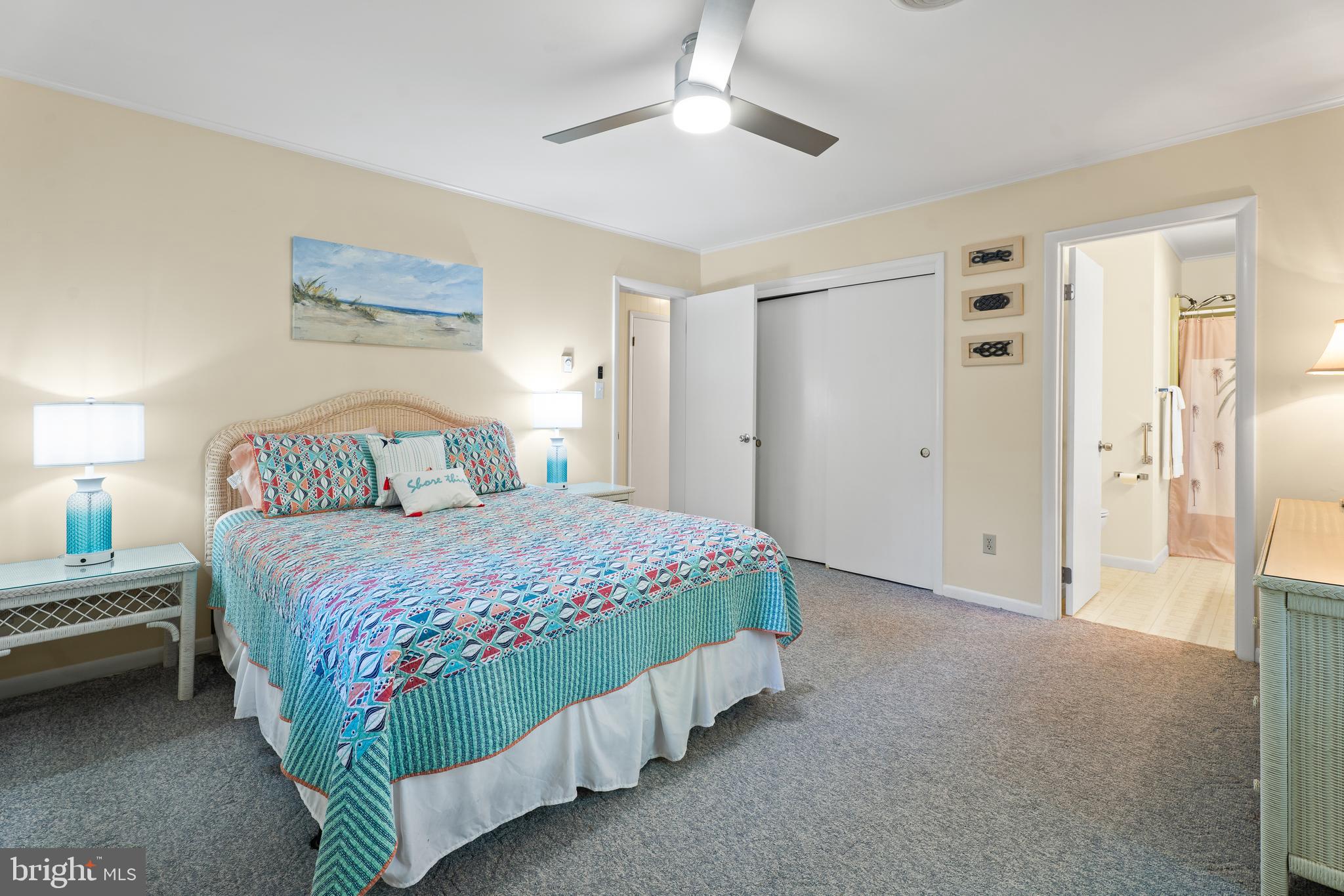 85 Ocean Parkway Ocean Pines, MD 21811 - Photo 27 of 78 a bedroom with a bed and a chandelier