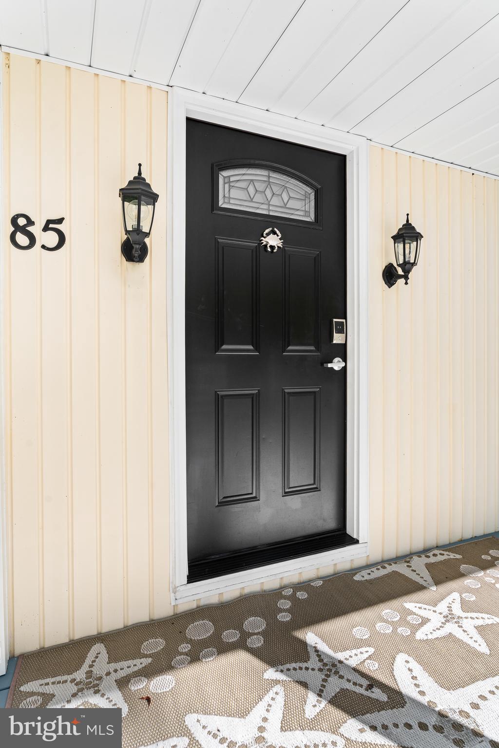 85 Ocean Parkway Ocean Pines, MD 21811 - Photo 3 of 78 a view of a hallway with wooden floor and a living room