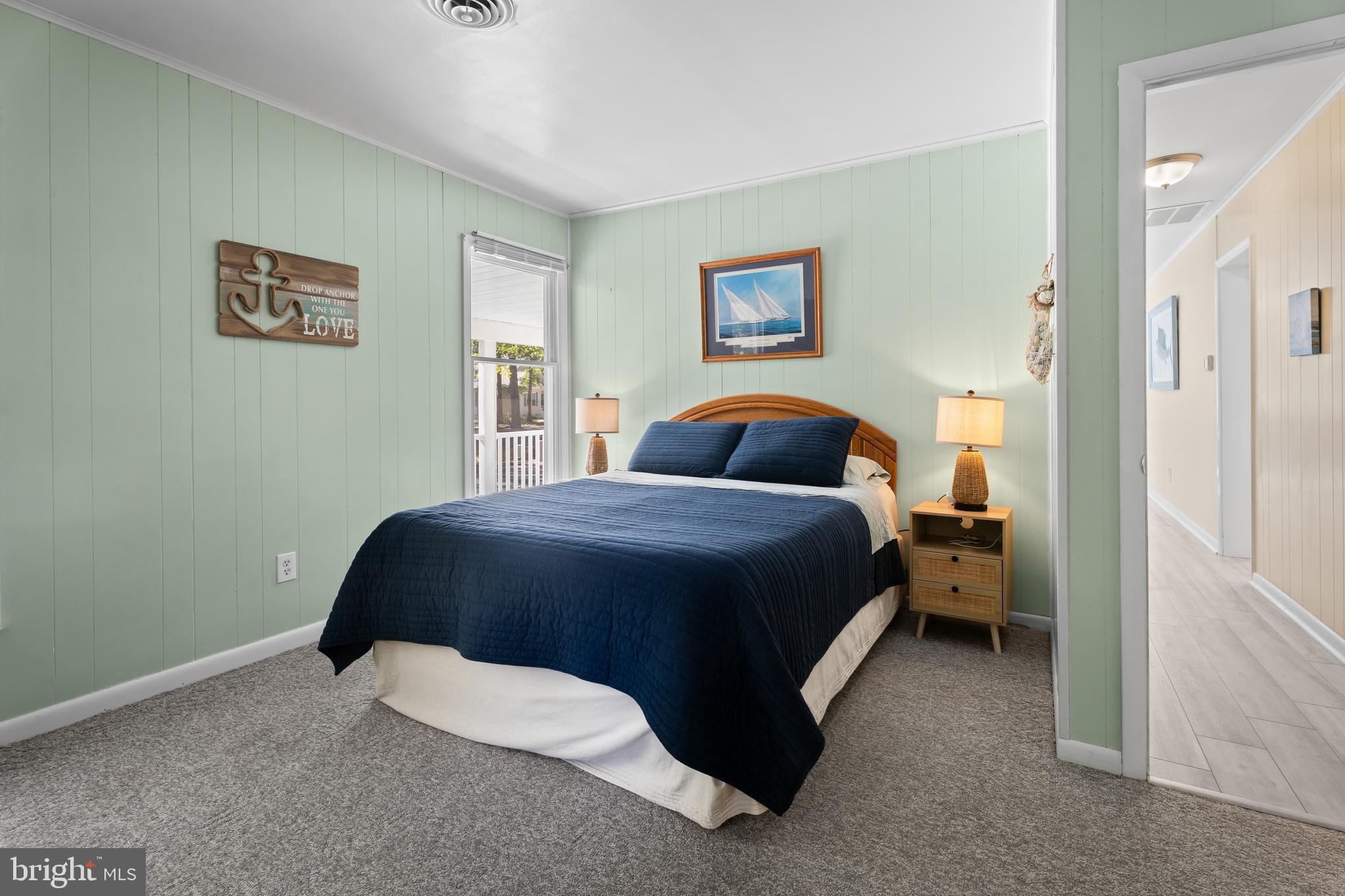 85 Ocean Parkway Ocean Pines, MD 21811 - Photo 34 of 78 a spacious bedroom with a bed and a painting on the wall