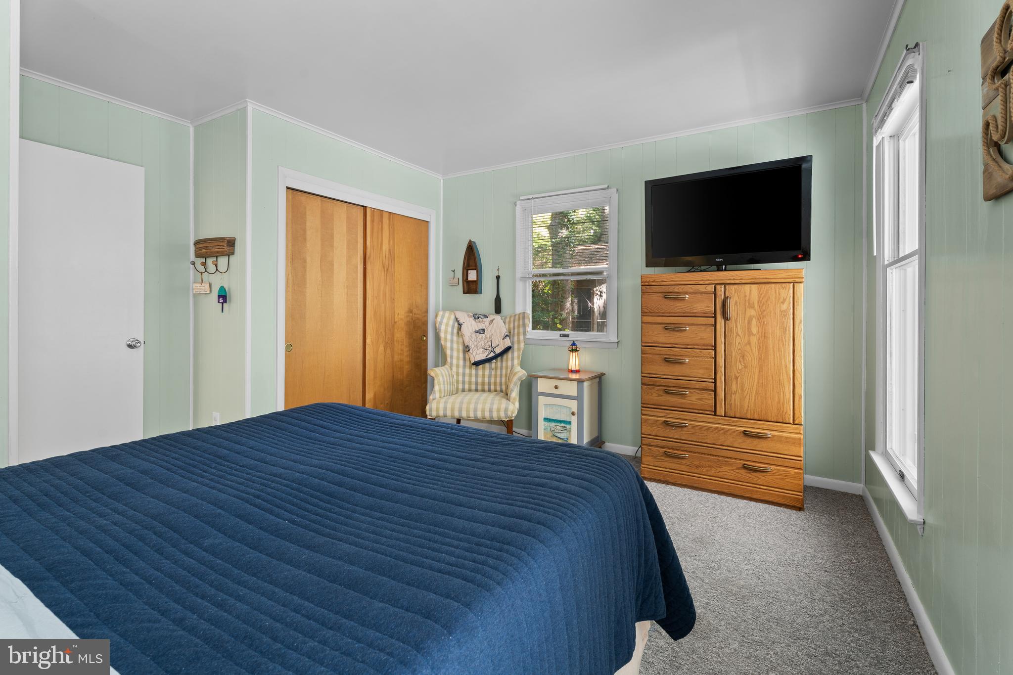 85 Ocean Parkway Ocean Pines, MD 21811 - Photo 37 of 78 a bedroom with a bed and wooden floor