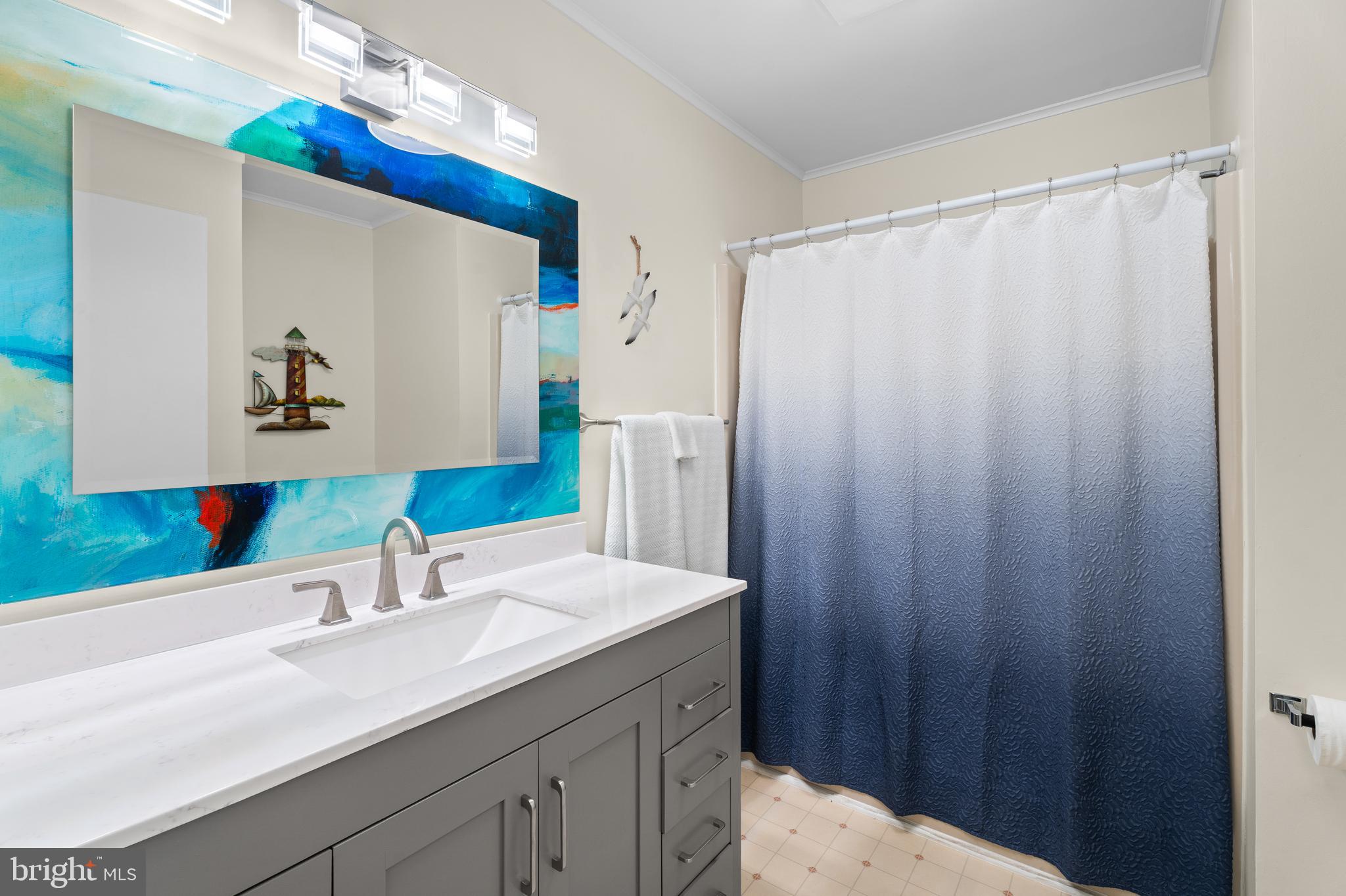 85 Ocean Parkway Ocean Pines, MD 21811 - Photo 39 of 78 a bathroom with a double vanity sink and a mirror