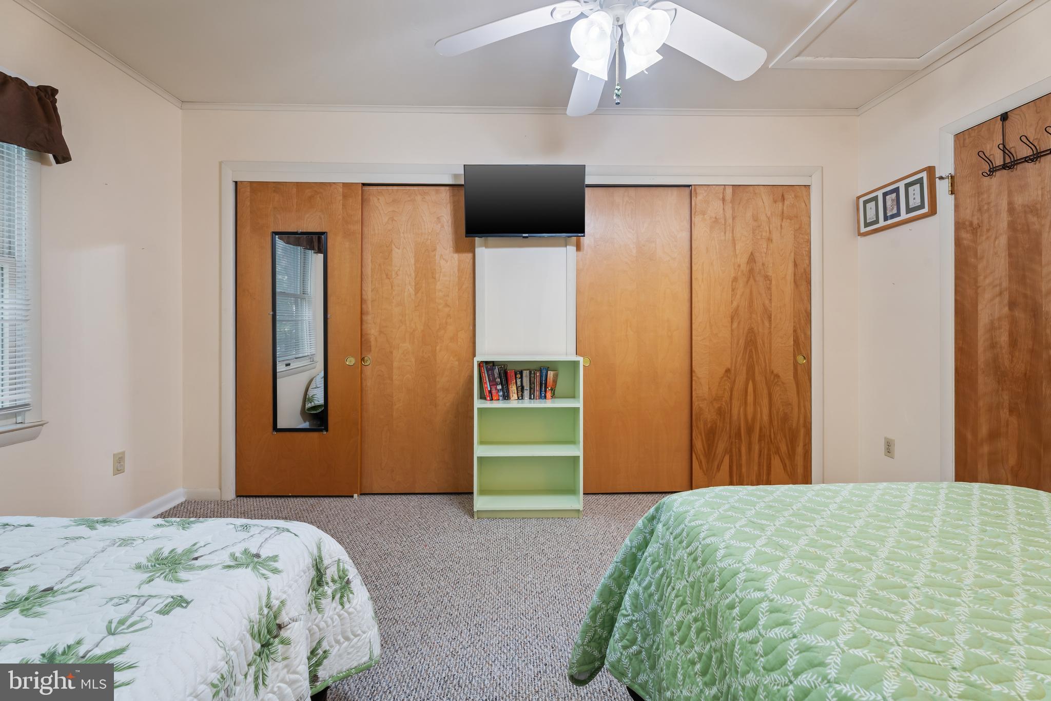 85 Ocean Parkway Ocean Pines, MD 21811 - Photo 47 of 78 a bedroom with a bed and a chandelier