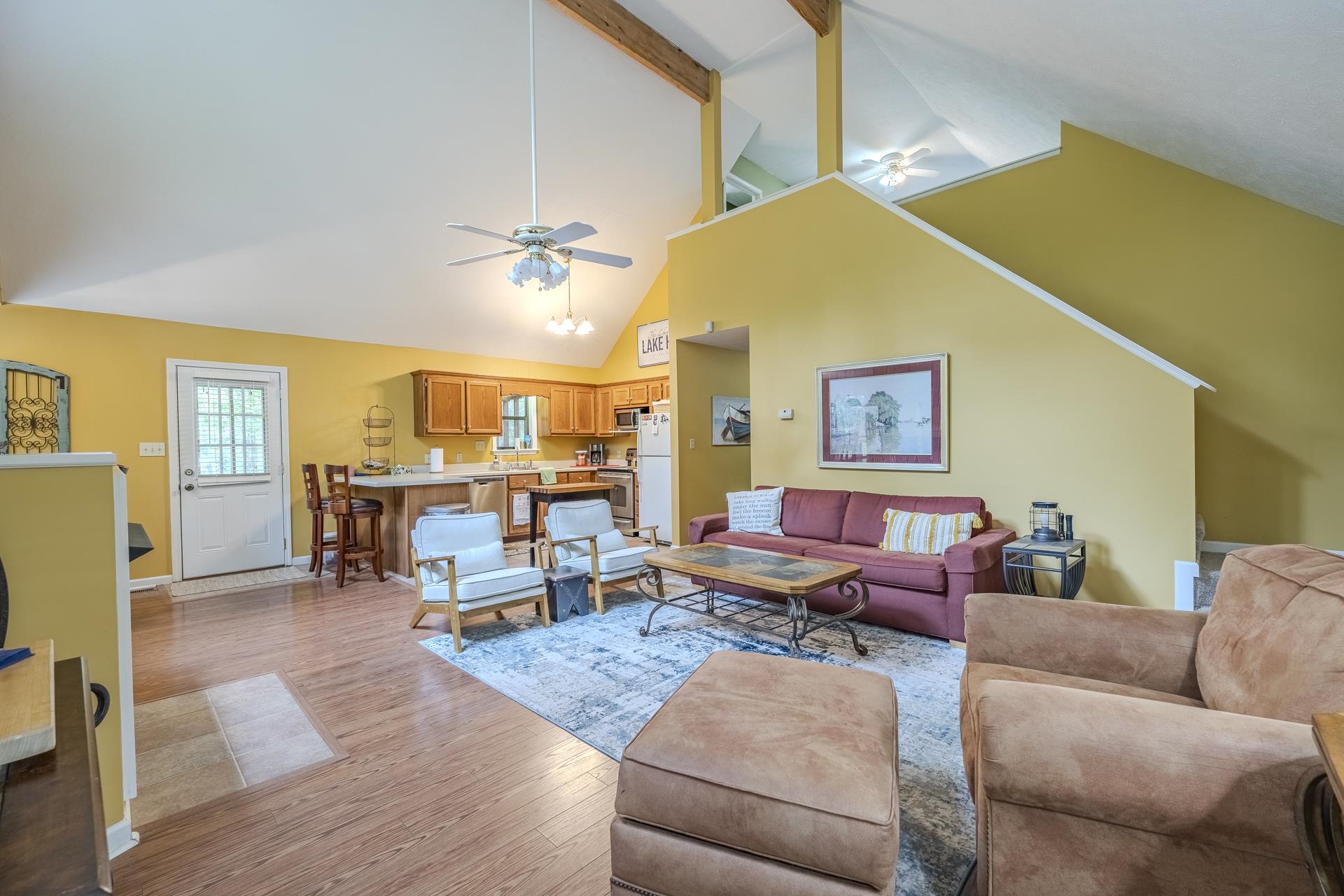 405 Murray Lane Counce, TN 38326 - Photo 10 of 36 a living room with furniture kitchen view and a chandelier