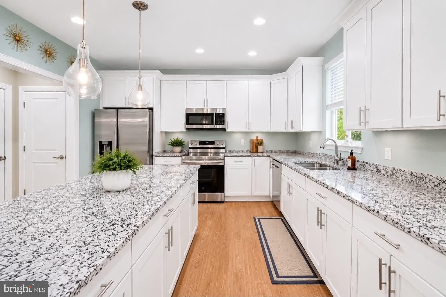 118 Ackerman Lane Ruther Glen, VA 22546 - Photo 6 of 57 a large kitchen with kitchen island white cabinets and stainless steel appliances