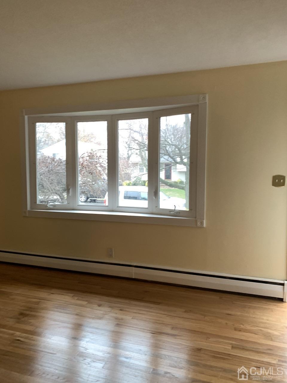 20 Finley Road Edison, NJ 08817 - Photo 11 of 16 a view of a room with wooden floor and a window