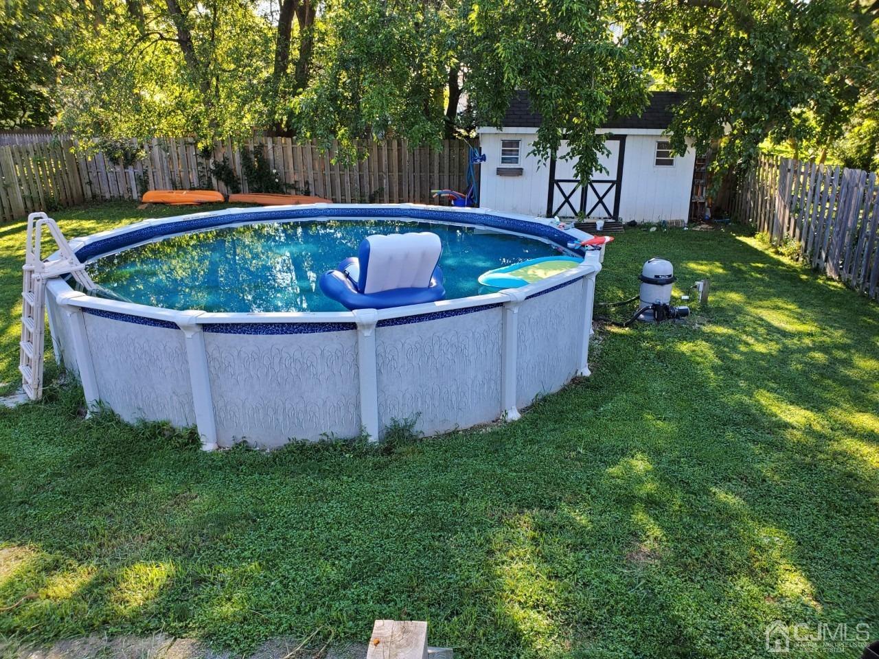 20 Finley Road Edison, NJ 08817 - Photo 14 of 16 a view of a backyard with a tub and trees