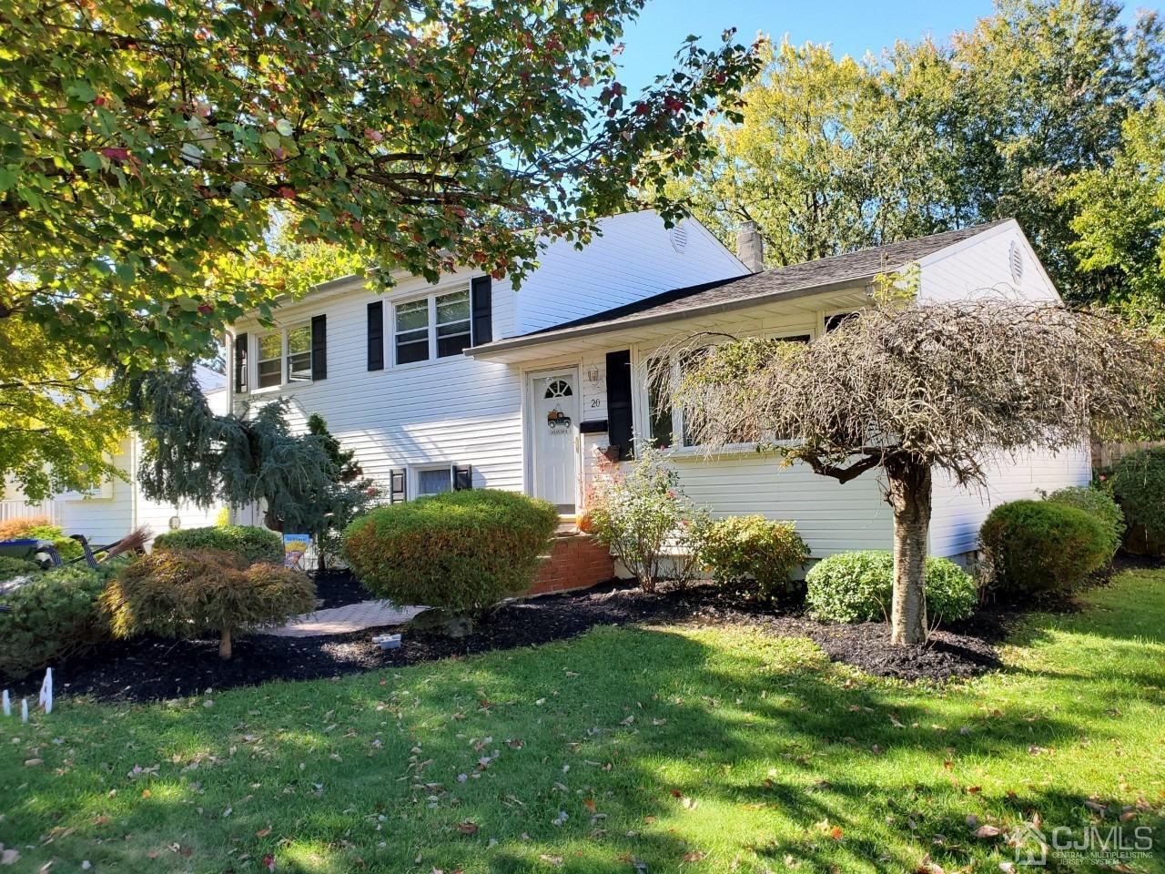 20 Finley Road Edison, NJ 08817 - Photo 5 of 16 a front view of a house with garden