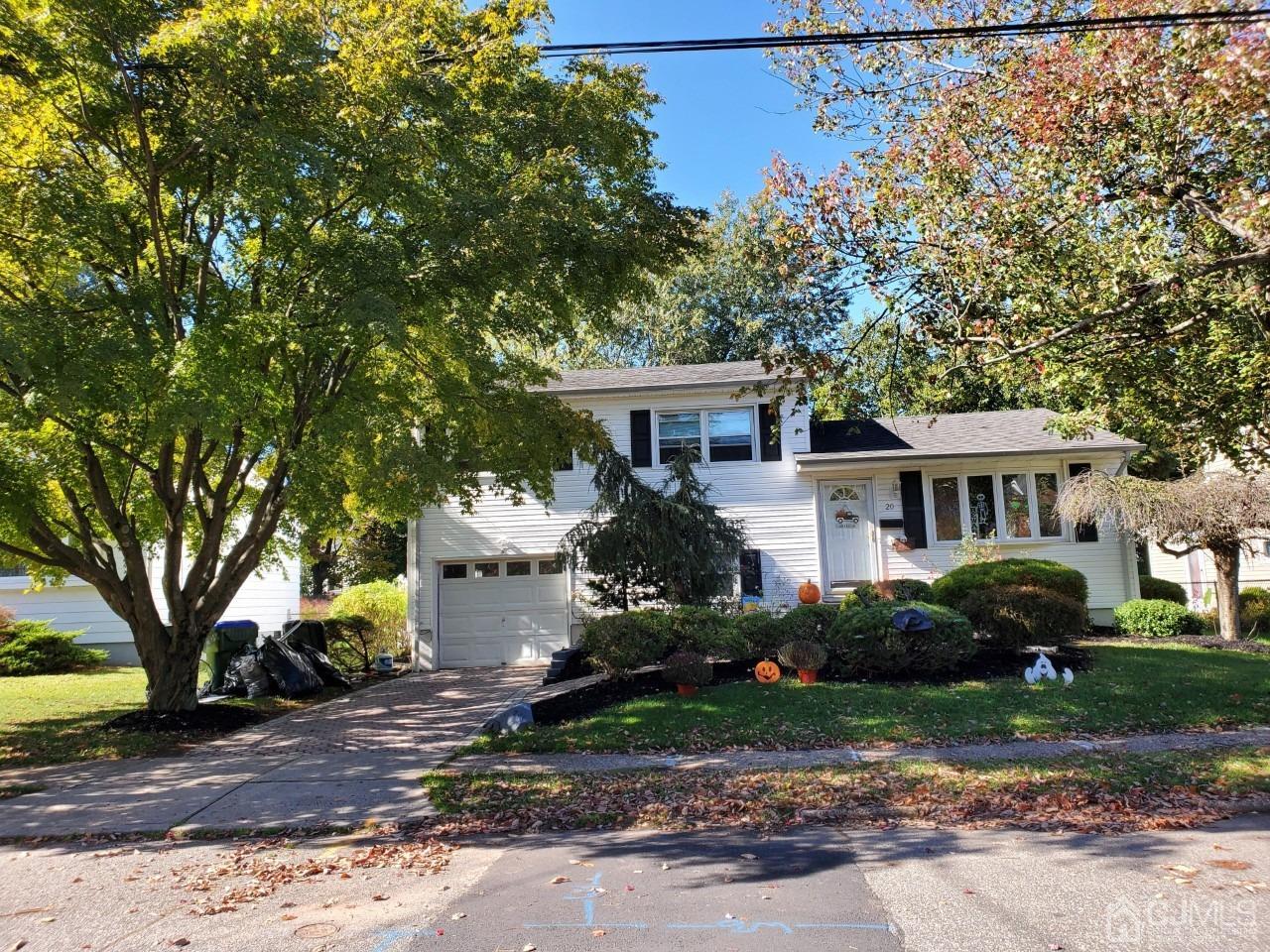 20 Finley Road Edison, NJ 08817 - Photo 6 of 16 a front view of a house with a garden