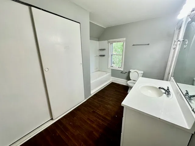 a en suite bathroom with a sink a mirror and a shower