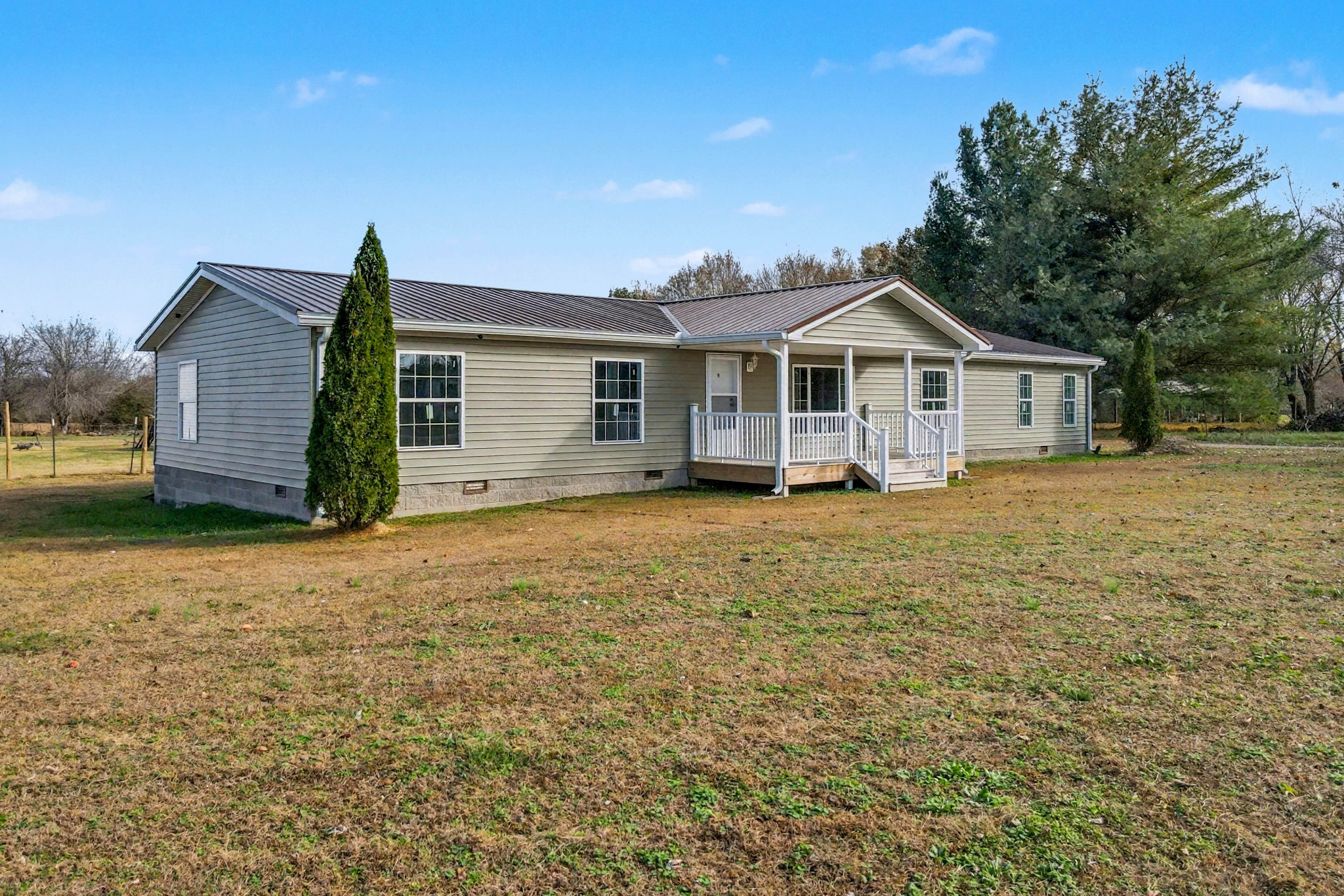 1834 Oak Grove Church Road Adolphus, KY 42120 - Photo 8 of 31 a front view of house with yard and trees in the background