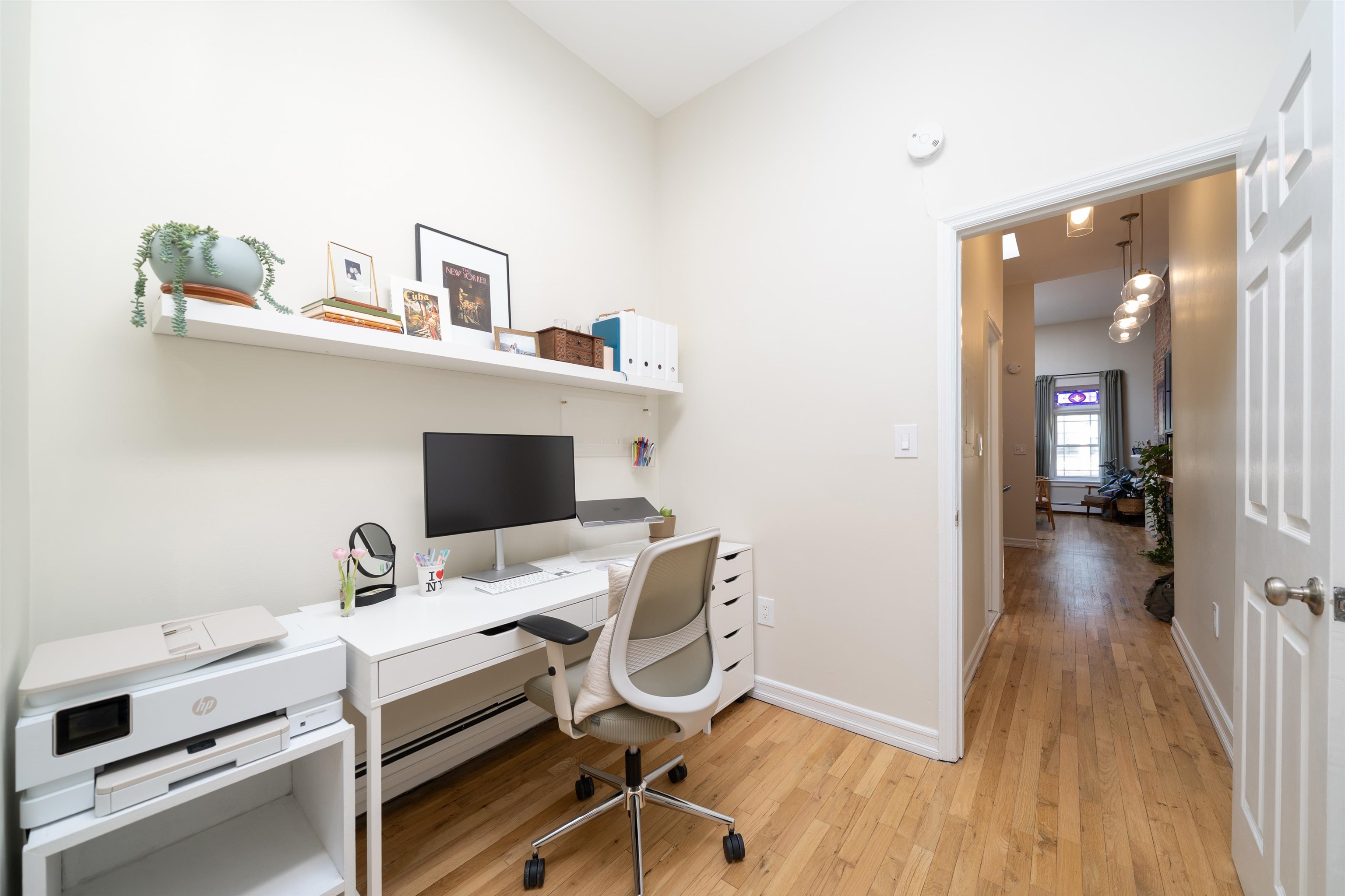 205 14th Street, Unit 4F Hoboken, NJ 07030 - Photo 14 of 22 a view of a workspace with furniture and wooden floor